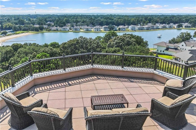 view of patio / terrace featuring a balcony and a water view