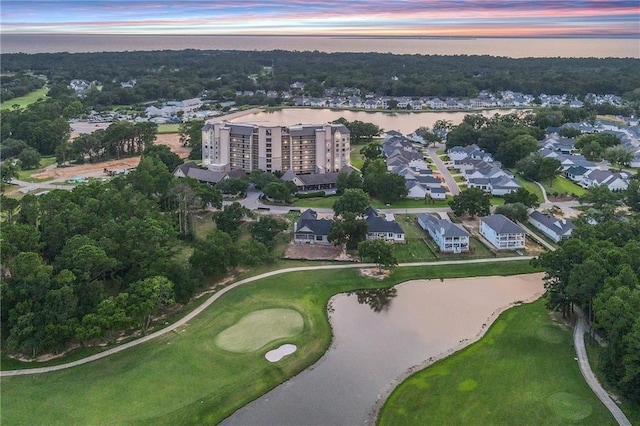 aerial view at dusk with a water view