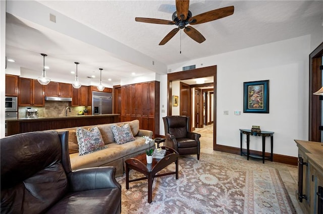 living room featuring ceiling fan