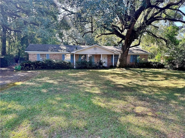 ranch-style home featuring a front yard