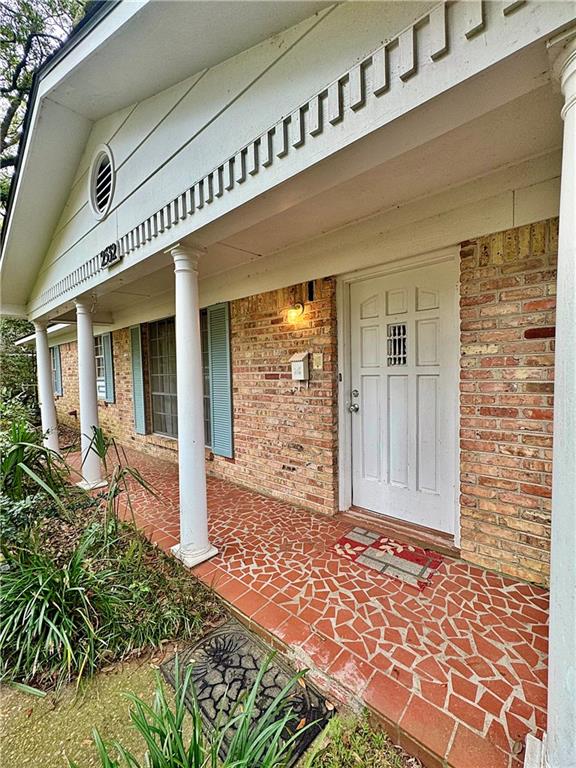 doorway to property featuring a porch