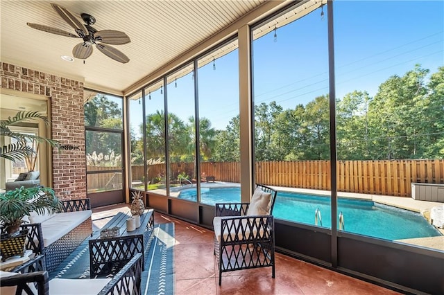 sunroom / solarium featuring ceiling fan