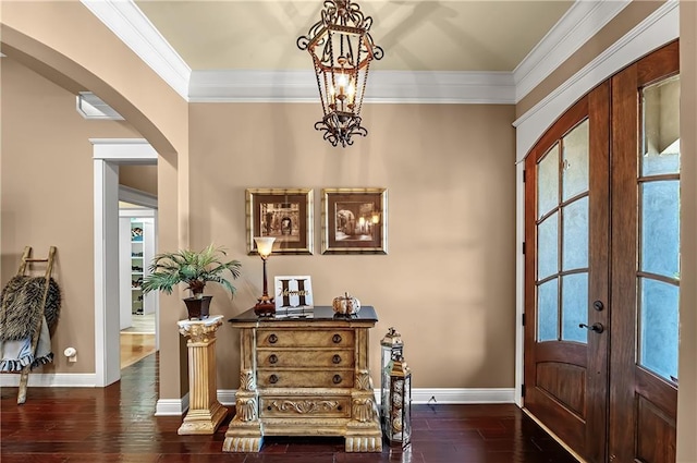 entryway featuring french doors, ornamental molding, and dark hardwood / wood-style flooring