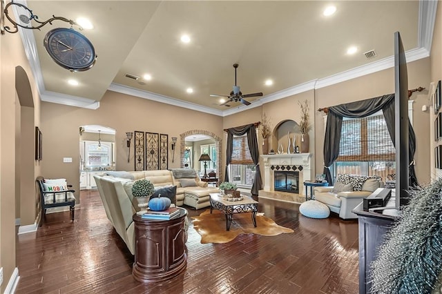 living room featuring ornamental molding, a healthy amount of sunlight, and dark hardwood / wood-style flooring