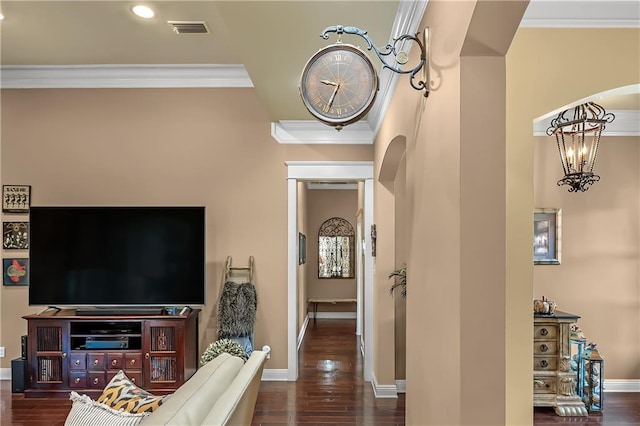 living room with ornamental molding and dark wood-type flooring