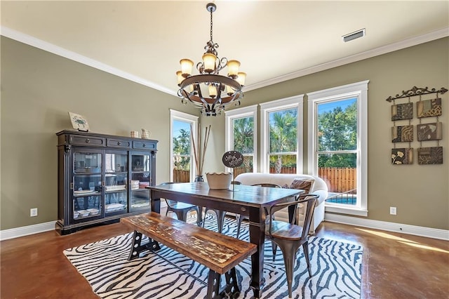 dining area featuring a notable chandelier and ornamental molding