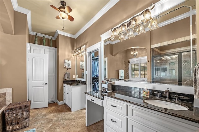 bathroom featuring ceiling fan, walk in shower, vanity, tile patterned floors, and ornamental molding