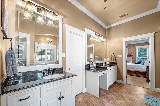 bathroom with vanity, crown molding, and tile patterned flooring