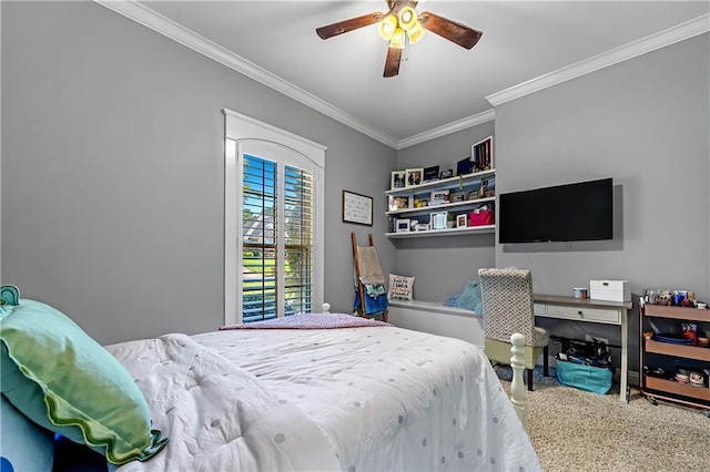 carpeted bedroom with ceiling fan and ornamental molding