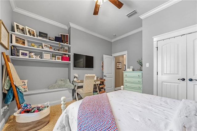 bedroom with ceiling fan, a closet, and crown molding