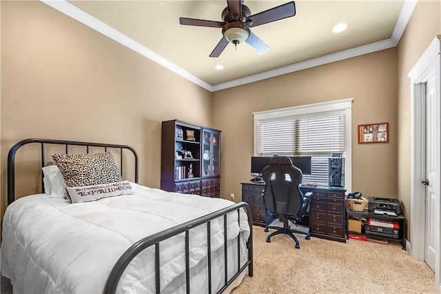 bedroom with ornamental molding, light colored carpet, and ceiling fan