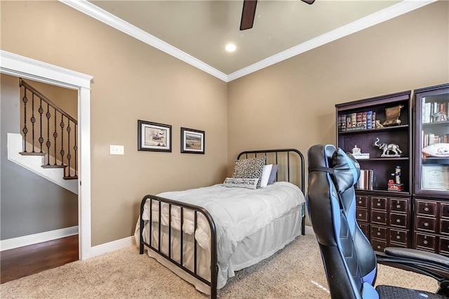 bedroom with ornamental molding, carpet flooring, and ceiling fan