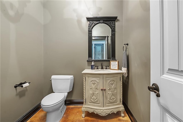 bathroom featuring hardwood / wood-style flooring, vanity, and toilet