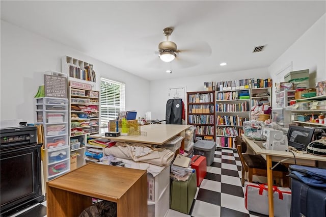 home office featuring a ceiling fan, visible vents, and tile patterned floors