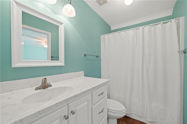 bathroom featuring toilet, a shower with shower curtain, vanity, visible vents, and crown molding