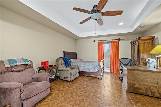 bedroom featuring visible vents, a tray ceiling, ceiling fan, and recessed lighting