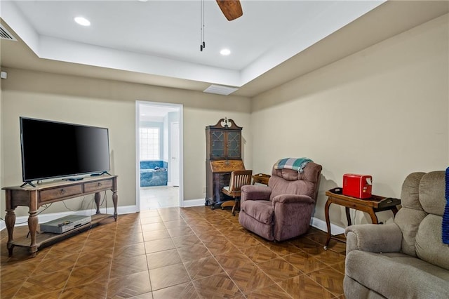 living room featuring a ceiling fan, recessed lighting, and baseboards