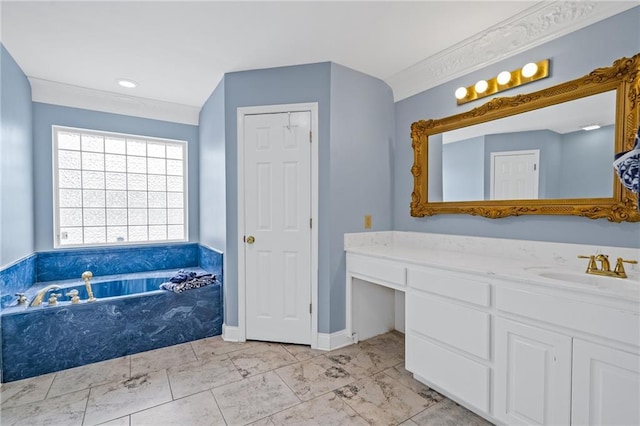 bathroom with ornamental molding, marble finish floor, a garden tub, and vanity