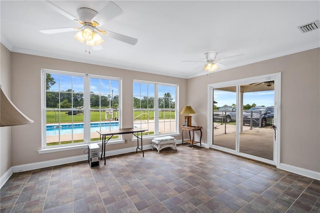 interior space with a ceiling fan, a healthy amount of sunlight, and visible vents