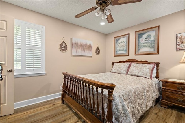 5719 Laurel Dr, Satsuma, AL 36572 - bedroom with wood finished floors, baseboards, a ceiling fan, and recessed lighting