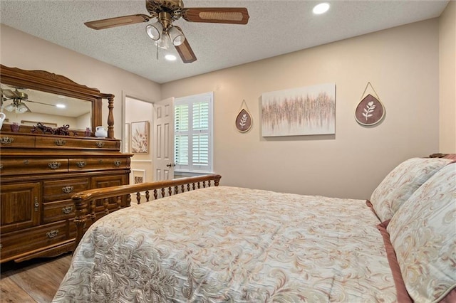 5719 Laurel Dr, Satsuma, AL 36572 - bedroom with wood finished floors, recessed lighting, ceiling fan, and a textured ceiling