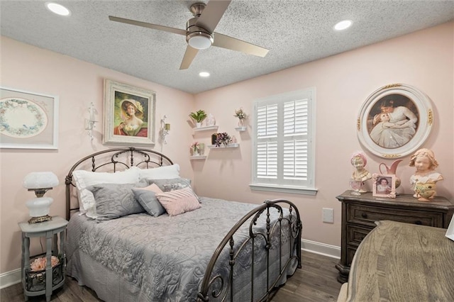 5719 Laurel Dr, Satsuma, AL 36572 - bedroom featuring dark wood-style floors, baseboards, a textured ceiling, recessed lighting, and a ceiling fan