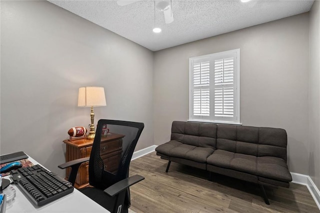 5719 Laurel Dr, Satsuma, AL 36572 - office space featuring wood finished floors, baseboards, a ceiling fan, and a textured ceiling