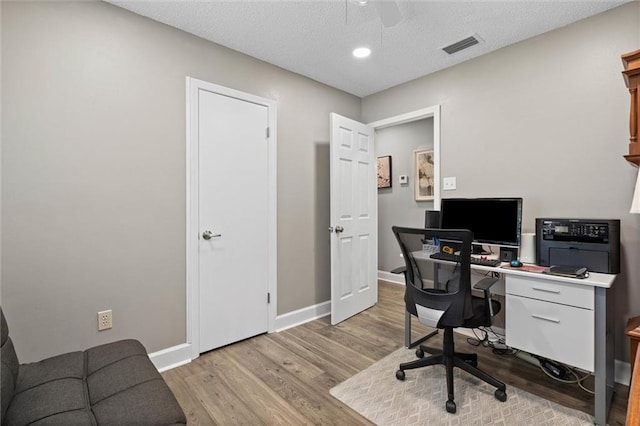 5719 Laurel Dr, Satsuma, AL 36572 - office space with light wood-style floors, a ceiling fan, baseboards, a textured ceiling, and recessed lighting