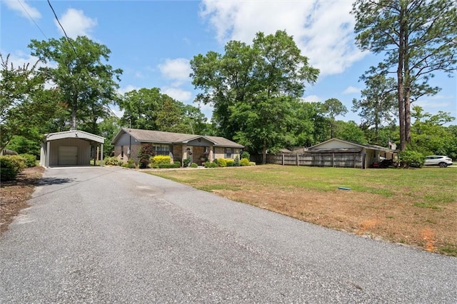 5719 Laurel Dr, Satsuma, AL 36572 - view of front of house featuring a carport and asphalt driveway