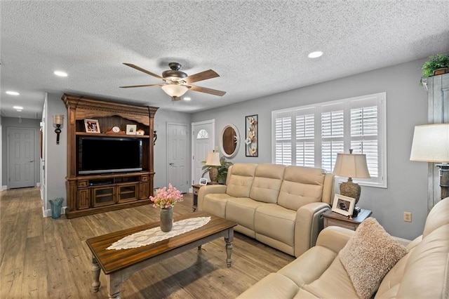 5719 Laurel Dr, Satsuma, AL 36572 - living area with ceiling fan, recessed lighting, a textured ceiling, wood finished floors, and baseboards
