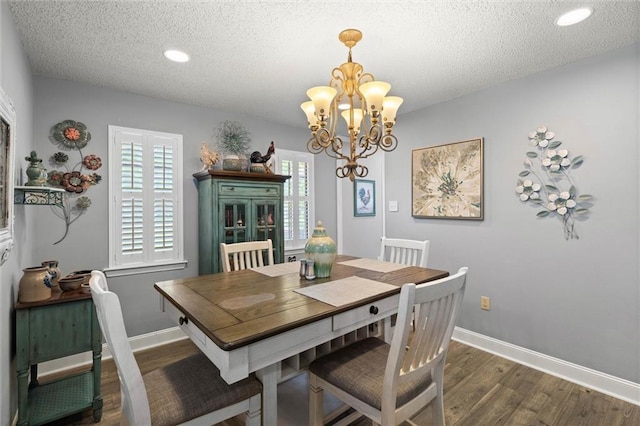 5719 Laurel Dr, Satsuma, AL 36572 - dining room with a chandelier, wood finished floors, a textured ceiling, baseboards, and recessed lighting