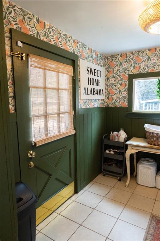 doorway to outside featuring light tile patterned floors