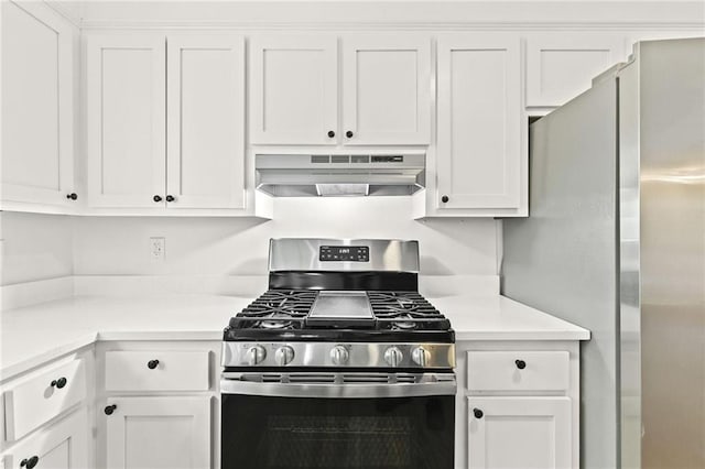 kitchen featuring stainless steel appliances, white cabinetry, and ventilation hood