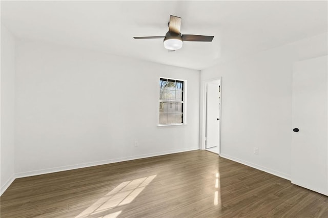 empty room featuring ceiling fan and hardwood / wood-style flooring