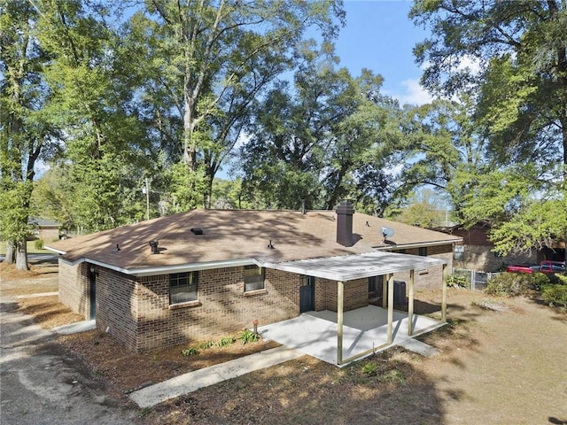 back of property with a patio