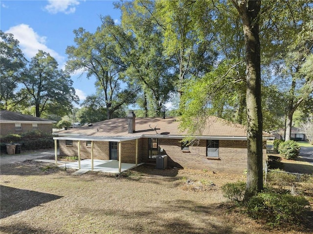 back of property featuring central AC and a patio area