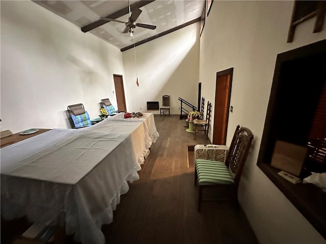 bedroom with high vaulted ceiling, ceiling fan, and hardwood / wood-style flooring