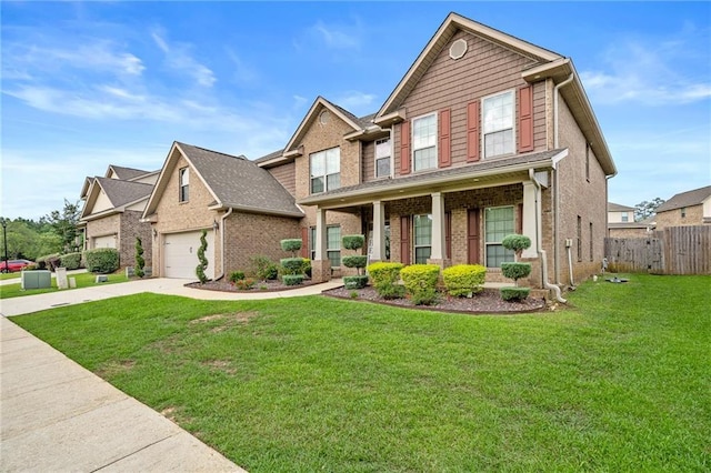 craftsman-style house with a porch, a garage, and a front lawn