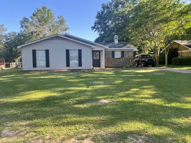 ranch-style home with a front lawn