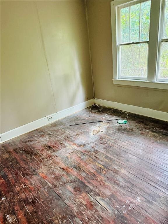 spare room featuring hardwood / wood-style floors