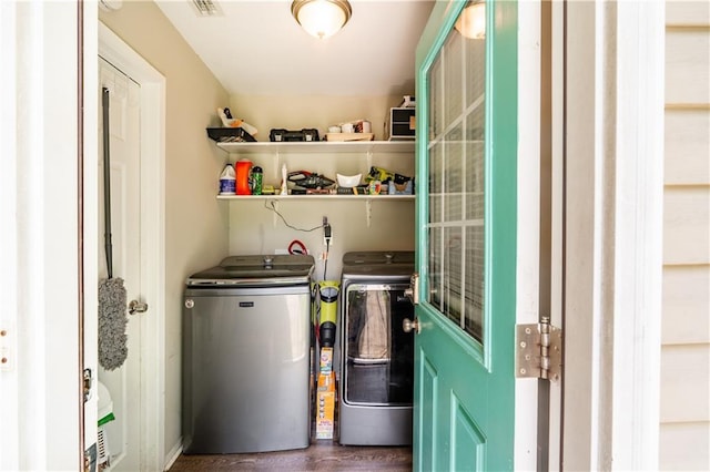 6250 Vivian Broadus Rd, Eight Mile, AL 36613 - laundry area with washing machine and dryer and dark wood-style floors