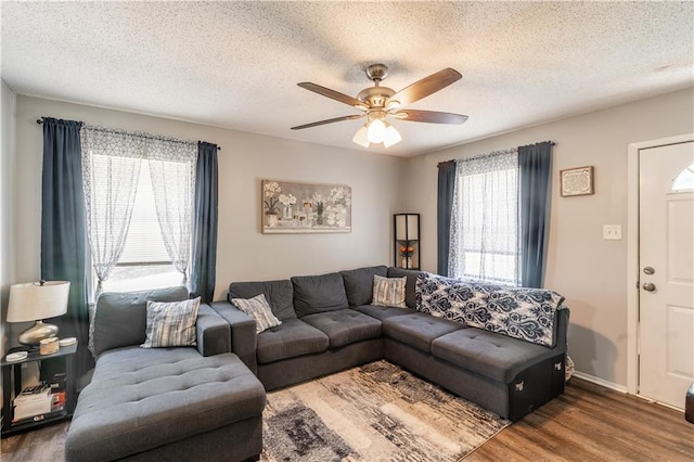 6250 Vivian Broadus Rd, Eight Mile, AL 36613 - living room with wood finished floors, a ceiling fan, and a textured ceiling