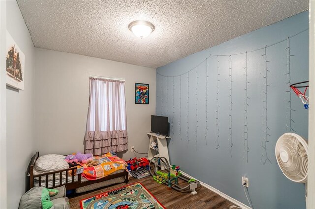 6250 Vivian Broadus Rd, Eight Mile, AL 36613 - game room with wood finished floors and a textured ceiling