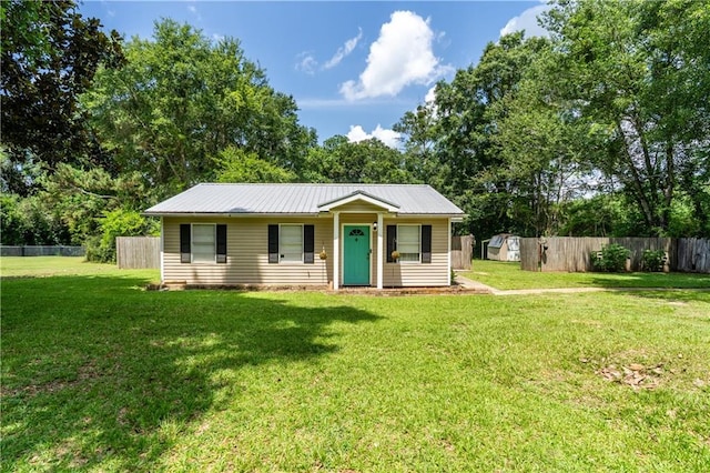 6250 Vivian Broadus Rd, Eight Mile, AL 36613 - view of front of house featuring a shed, a metal roof, and view of scattered trees