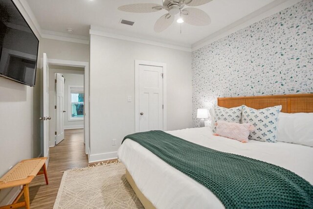 bathroom featuring hardwood / wood-style floors, a shower with shower door, toilet, and vanity