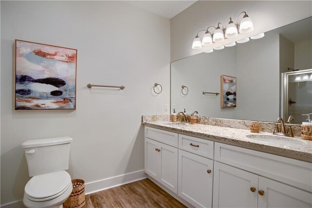 kitchen featuring wooden ceiling, light stone counters, sink, and light hardwood / wood-style floors