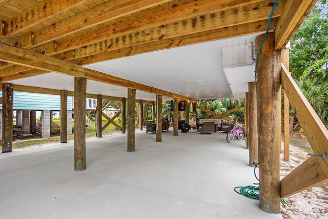 view of patio with an outdoor living space with a fire pit