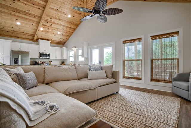 living room with high vaulted ceiling, hardwood / wood-style floors, sink, ceiling fan, and wooden ceiling