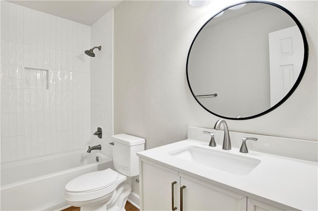 bathroom with toilet, tub / shower combination, and vanity