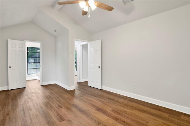 spare room with wood finished floors, ceiling fan, and baseboards